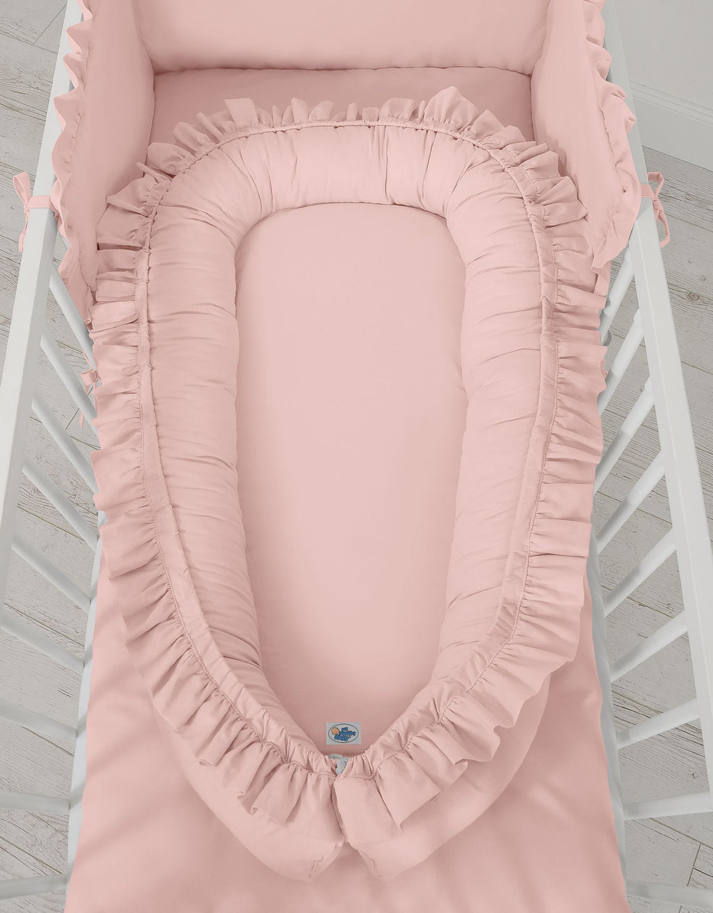 Baby nest Premium Cocoon for infants with a ruffle - pastel pink